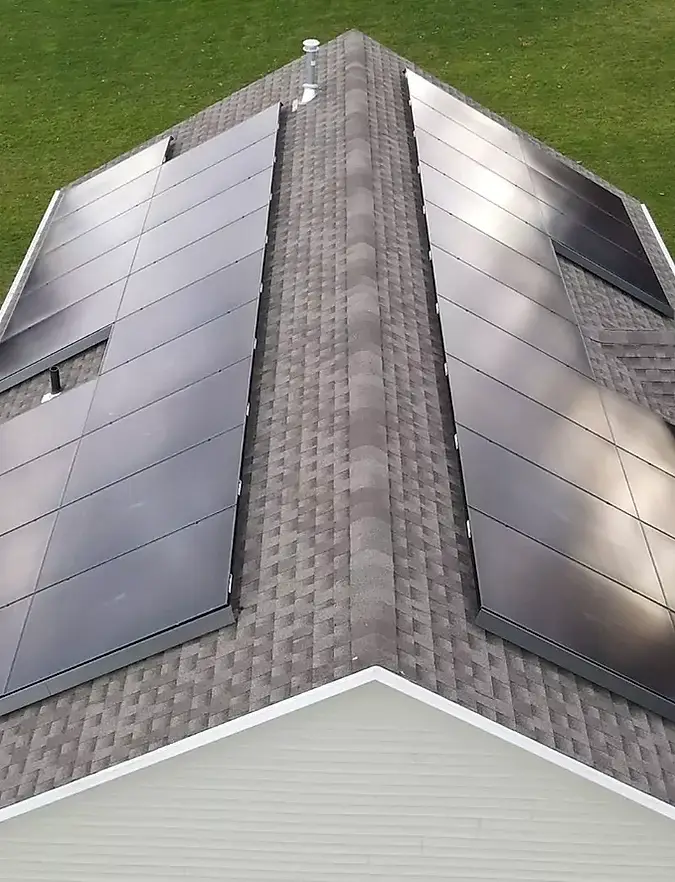 Close-up view of solar panel installation on Connecticut home by Premier Improvements Solar, showcasing precision flush mount design on asphalt shingle roof